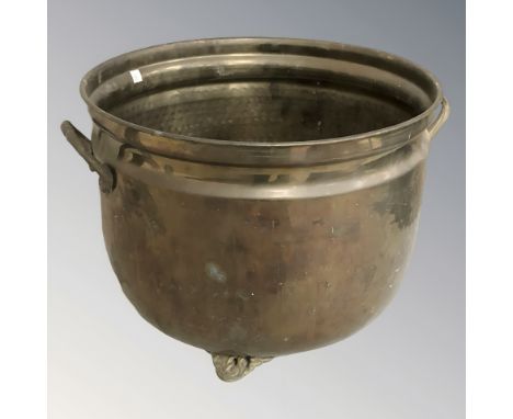 A brass twin handled planter, height 24 cm.