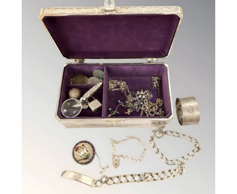 A George III enamelled crown 1819, several other coins, silver napkin ring, bracelets stamped '925' or 'Silver', costume jewe