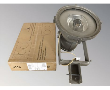 A spotlight and a ceramic cooker top in box  