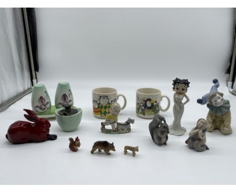 Assorted Lot to include royal Doulton Red Flambé Rabbit, Wade - Betty Boop - Material Girl, NAO, Royal Copenhagen and others.