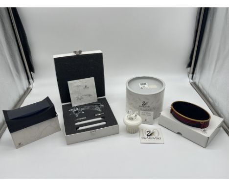 Boxed Swarovski Crystal Comet Candlestick, Swan and Two Stands. 
Good condition, no damage.