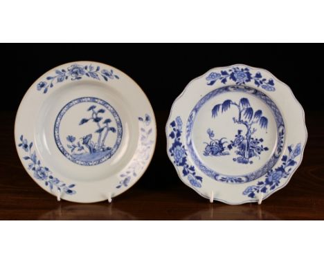 Two 19th Century Chinese Blue & white Dishes: One painted with a pine tree and flowers to the centre panel framed by a ring o