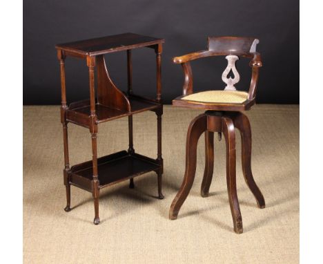 A Edwardian three tier manuscript stand and a child's revolving high chair (A/F). The stand with rectangular top above a part