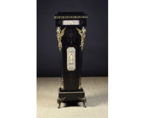 A Victorian Ebonised Pedestal inset with relief moulded plaques of polychrome enamelled cherubs and adorned with gilt metal m