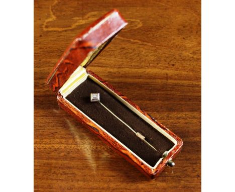 A 56 Standard Gold Tie Pin set with a small diamond and presented in a case with Fabergé style stamp.