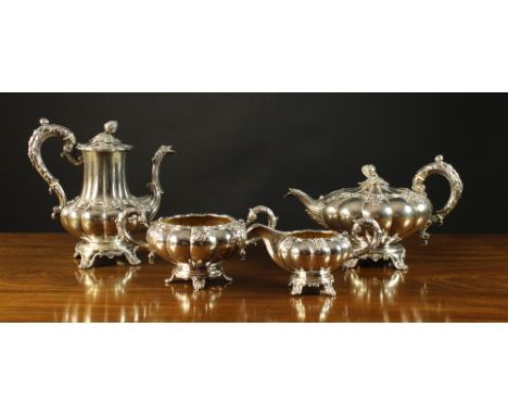 A Victorian Four Part Silver Plated Tea Service comprising of teapot, hot water pot, milk jug and sugar basin. The lobed side