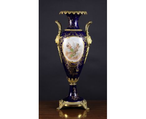 A Tall 19th Century Sèvres Style Pedestal Vase with gilt metal mounts.  The slender ovoid body having decoratively cast femal