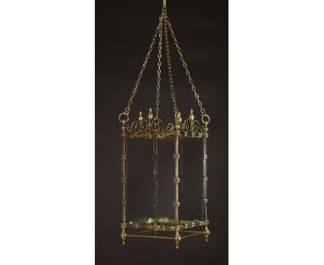 A Square Brass-framed Hall Lantern with clear glass sides.  The frame studded with ornamental quatrefoil flower-heads and sur