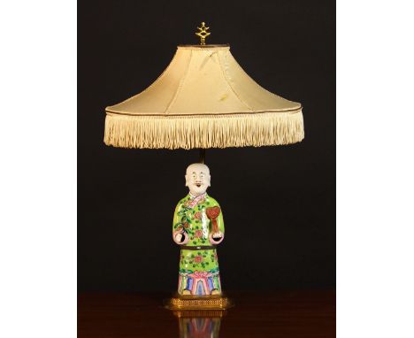 A 19th Century Chinese Ceramic Figure of an Immortal mounted as a lamp.  The hollow moulded figure depicted with a bald head 
