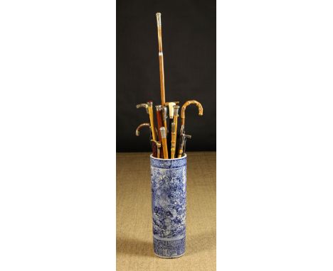 A Collection of Victorian & Later Riding Whips, Sticks & Umbrellas in a 19th Century Blue & White Ceramic Stick Stand.  The c