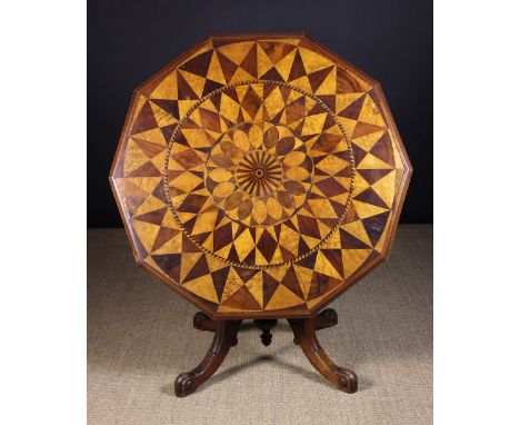 A 19th Century Parquetry Tilt-top Breakfast Table. The octagonal top decorated with concentric bands of geometric designs dep