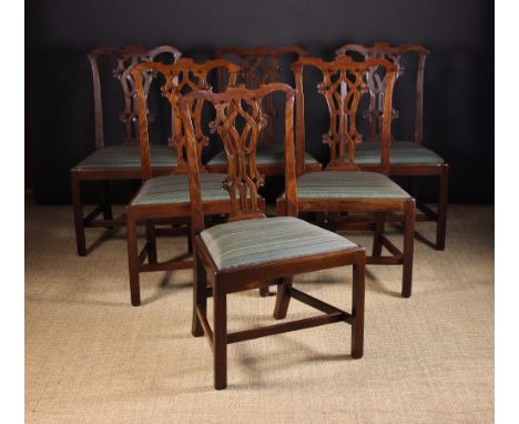 A Set of Six 19th Century Chippendale Style Mahogany Dining Chairs.  The shaped top rails above pierced centre splats carved 