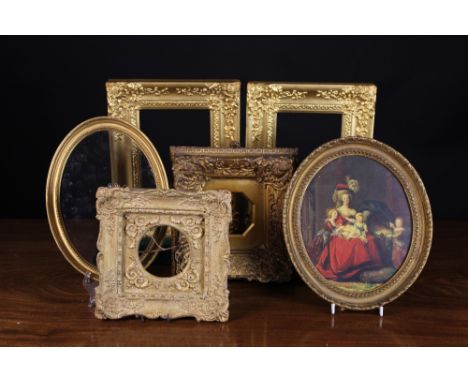 Six Decorative Gilt Frames: A small print of an 18th century family portrait in a 1½ ins (4 cm) cavetto moulded oval frame ed
