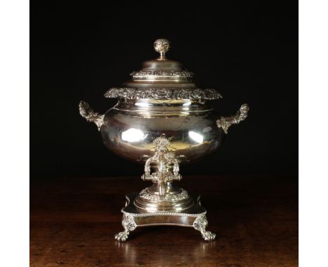 A Victorian Silver Plated Samovar.  The bulbous body fitted with a reeded tap and raised on a flared pedestal above a quadrif