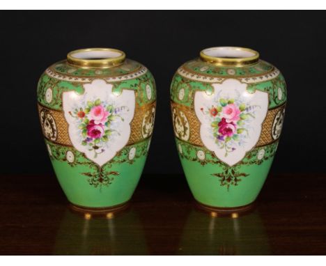 A Pair of L & Co Nippon Noritake Vases. The ovoid  bodies decorated with floral bouquets in shield shaped cartouches on an ap