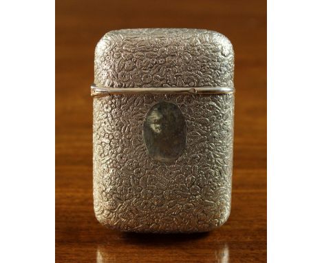 A Russian Silver Cigarette Case with Fabergé mark. The rectangular cushion form case embossed and chased with millefleur deco