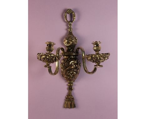 A Pair of Ornate Silver Plate on Copper Twin-branch Wall Sconces. The urn-shaped wall mounts cast and chased with scrolling f