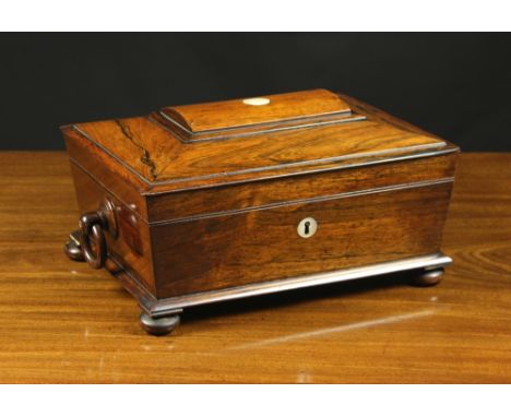 A Victorian Rosewood Work Box of sarcophagus form. The rectangular top having a raised moulded panel to the centre inlaid wit