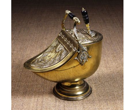 A Fine Quality Victoiran Brass Coal Scuttle embossed with Neo-classical style decoration and having a down swept hinged lid t