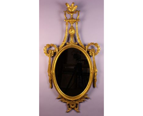 A Neo-Classical Giltwood Girondole.  The oval mirror in a beaded frame above sprays of wheat flanking a rosette mount.  The p