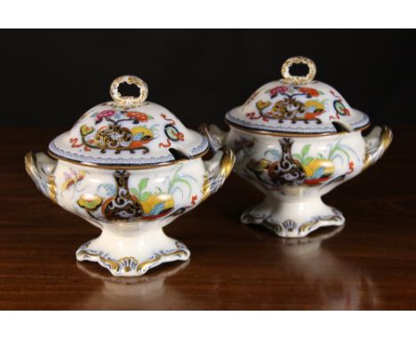A Pair of Victorian Staffordshire Sauce Tureens and Covers with twin handles and pedestal bases. Decorated in printed chinois