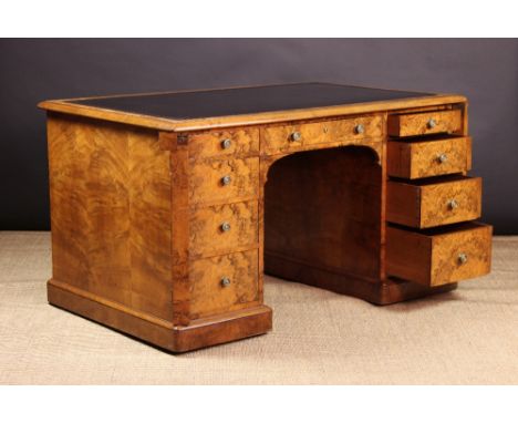 A Fabulous Gillows Quality 19th Century Burr Walnut Pedestal Desk.  The rectangular top having a black leather insert with to