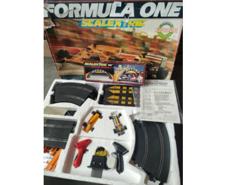 A large boxed formula one Scalextric together with a boxed Scalextric Dunlop bridge 