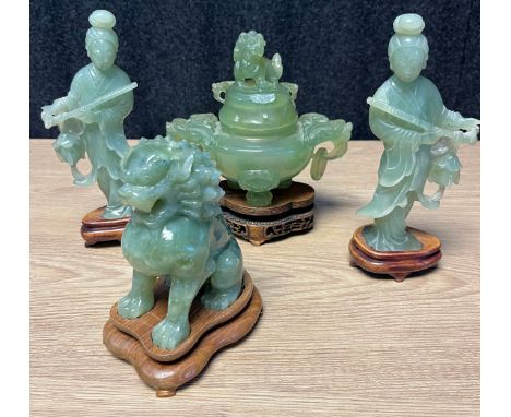 A lot of four Chinese green jade sculptures; A Pair of Geisha figures on wooden stands, Censor lidded pot with two  foo dog h