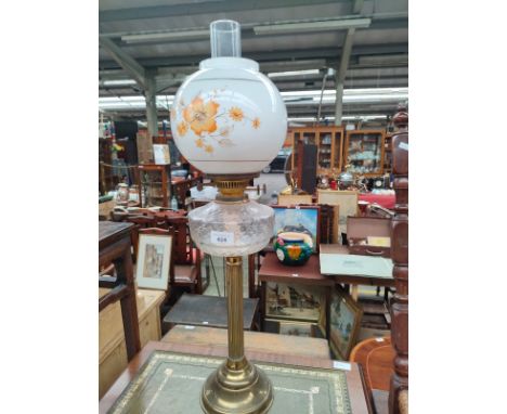 A Victorian oil lamp with globe glass shade 