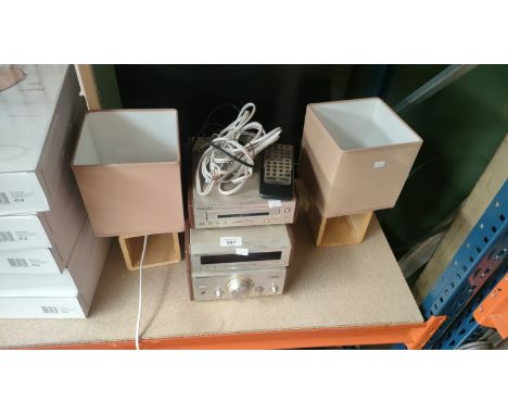 A Technics stereo amplifier, stereo tuner, cd player together with a Bush tv and a pair of table lamps 