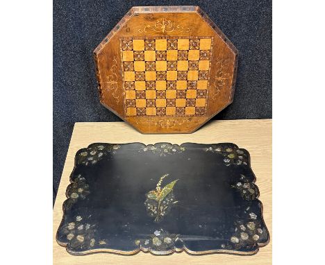 Two 19th century table tops converted to wall panels; Marquetry chess board table top and the other is black lacquered with m