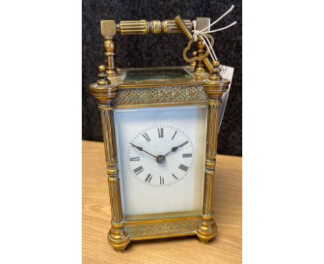 French brass carriage clock- late 19th century- the enamel white dial with black Roman numerals, column anglaise riche case w