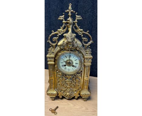 Antique gilt brass and ornate mantel clock, French movement by HP &amp; Cie Paris. Bell movement. Detailed with bird, greenma