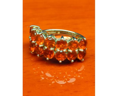 9ct yellow gold ladies ring set with 14 fire opal stones. [Ring size N] [3.34grams] 
