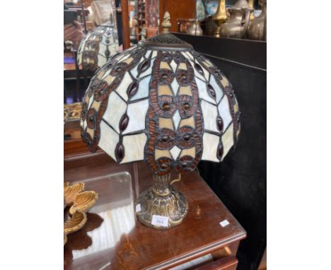 A Tiffany style table lamp and shade in working condition 