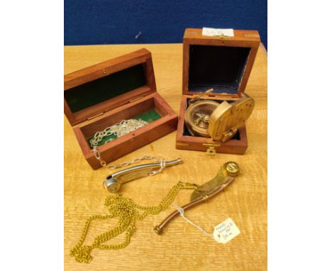 A brass Stanley London compass in fitted case along with 2 Bossons calls