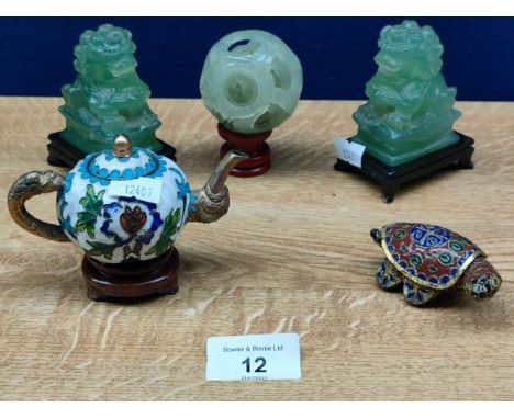 A Selection of oriental collectables includes a pair of jade dog of foo sculptures along with cloisonne wares and jade style 