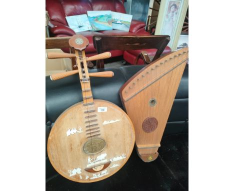 An Eastern themed musical instrument along with zither 