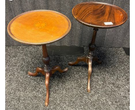 A lot of two 19th century circular wine tables, raised on tripod bases 