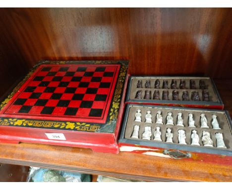 An Early oriental chess board with chess pieces 
