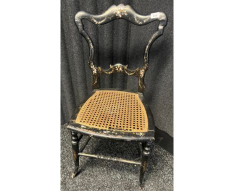 19th century black lacquered, gilt trim and mother of pearl inlayed bedroom chair. Has original rattan pad area. 