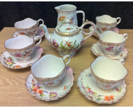 A Set of 6 Dresden shell design cups and saucers, Dresden tea pot and cream jug, All with hand painted floral designs. 