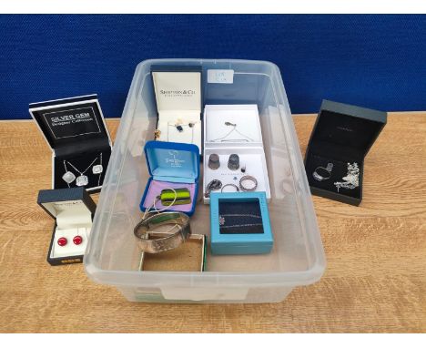 A Tub containing a collection of silver boxed and loose jewellery to include Celtic wedding band ring, Thimbles, Pendant, Ear