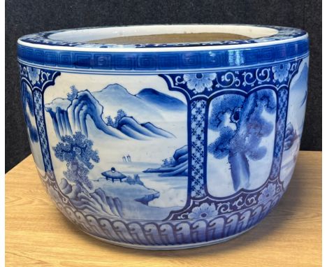 A Large 20th century blue and white panel painted planter. [29.5cm high, 45.5cm diameter] 