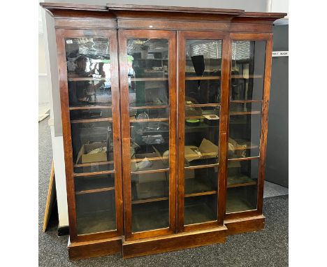 A Large 19th century three section breakfront bookcase, Four glass panel doors and fitted with movable interior shelving. [19