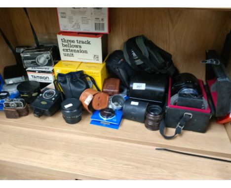 A Large Shelf of Camera lenses to include Tamron  &amp; A  selection of camera accessories 