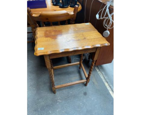 A Light oak lamp table with barley twist legs 