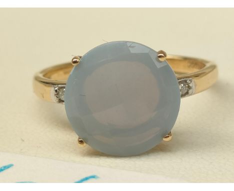 10CT Yellow gold ladies ring set with a large opalescent stone and gem stones to each shoulder. [Ring size R] [3.09Grams] 