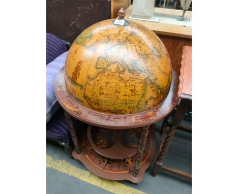 A reproduction globe drink cabinet 