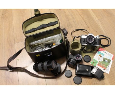 Canon AE1 camera with lenses and carrying case